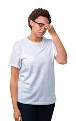 Beautiful young african american woman wearing glasses over isolated background tired rubbing nose and eyes feeling fatigue and headache. Stress and frustration concept.