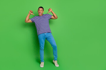 Photo of glad positive man wear striped stylish outfit indicating himself isolated on green color...