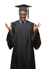 Young graduated african american man over isolated background crazy and mad shouting and yelling with aggressive expression and arms raised. Frustration concept.