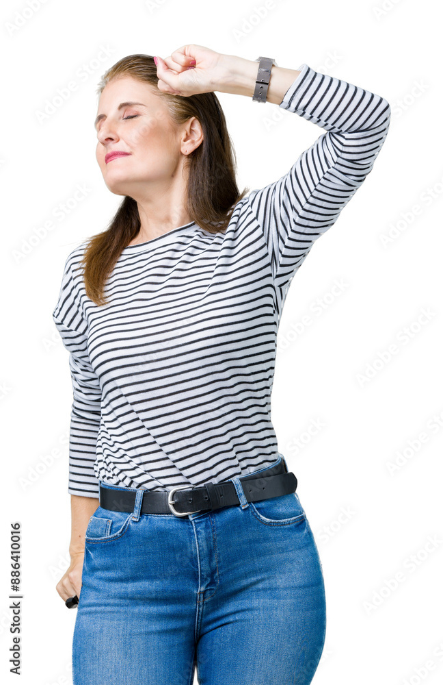 Wall mural Middle age mature beautiful woman wearing stripes winter sweater over isolated background stretching back, tired and relaxed, sleepy and yawning for early morning