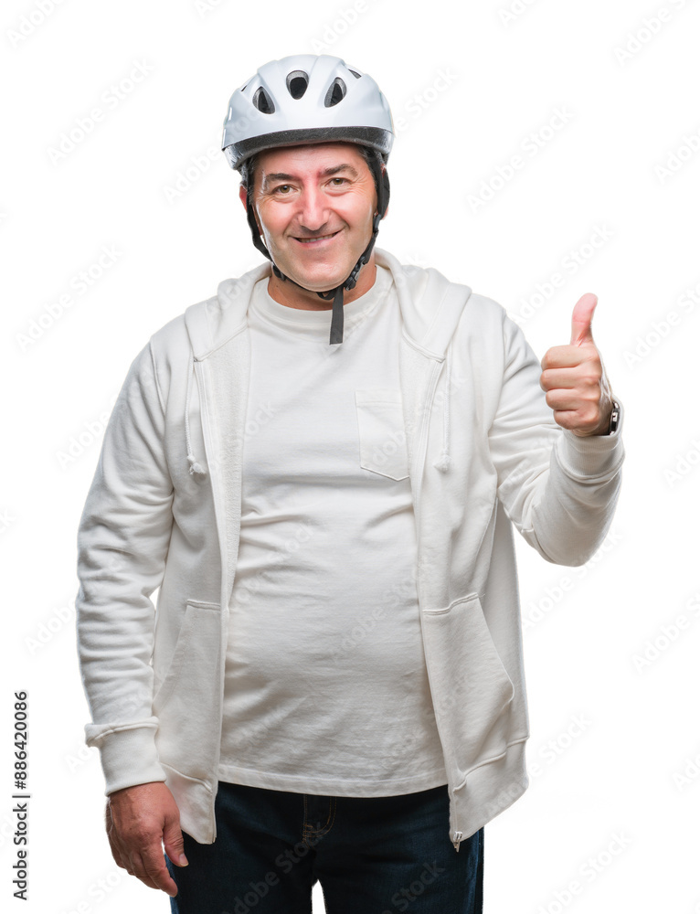 Canvas Prints Handsome senior cyclist man wearing bike helmet over isolated background happy with big smile doing ok sign, thumb up with fingers, excellent sign