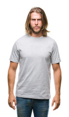 Obraz premium Young handsome man with long hair over isolated background skeptic and nervous, frowning upset because of problem. Negative person.