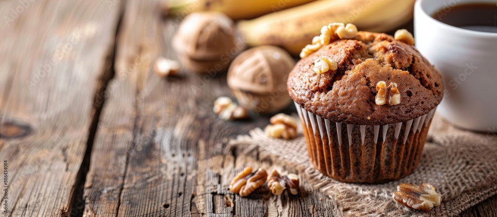 Aufkleber Close up of a banana nut muffin served alongside coffee for breakfast on a vintage rustic wood kitchen table The image features selective focus and copy space
