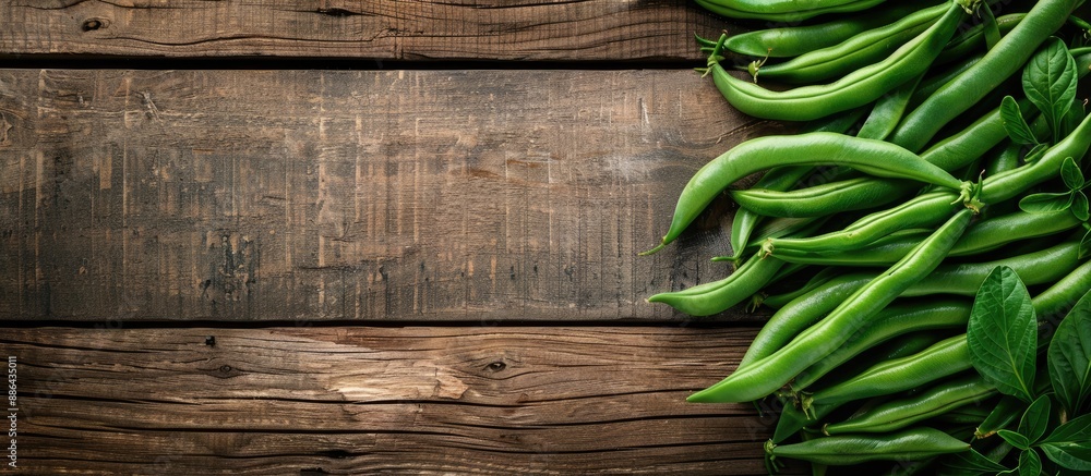 Poster wooden background showcasing fresh green beans with room for text or other elements in the image. wi