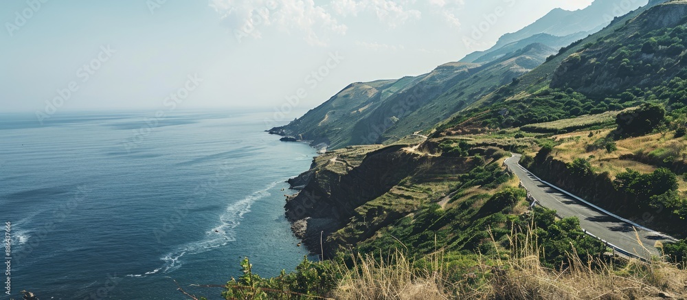 Aufkleber scenic coastal mountain road with a view of the sea providing a background with ample copy space ima