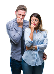 Young workers business couple over isolated background looking stressed and nervous with hands on mouth biting nails. Anxiety problem.