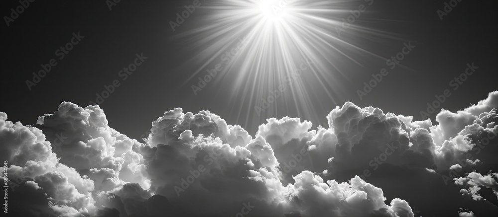 Poster monochrome texture split into black sky and sunlit clouds providing copy space image