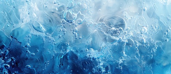 Obraz premium Abstract blue water surface with waves and ripples texture Aquatic moisturizer with bubbles and transparent ice glass ideal as a copy space image