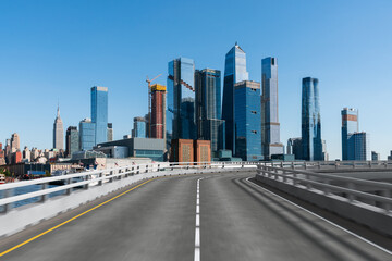 Empty urban asphalt road exterior with city buildings background. New modern highway concrete construction. Concept of way to success. Transportation logistic industry fast delivery. New York. USA.