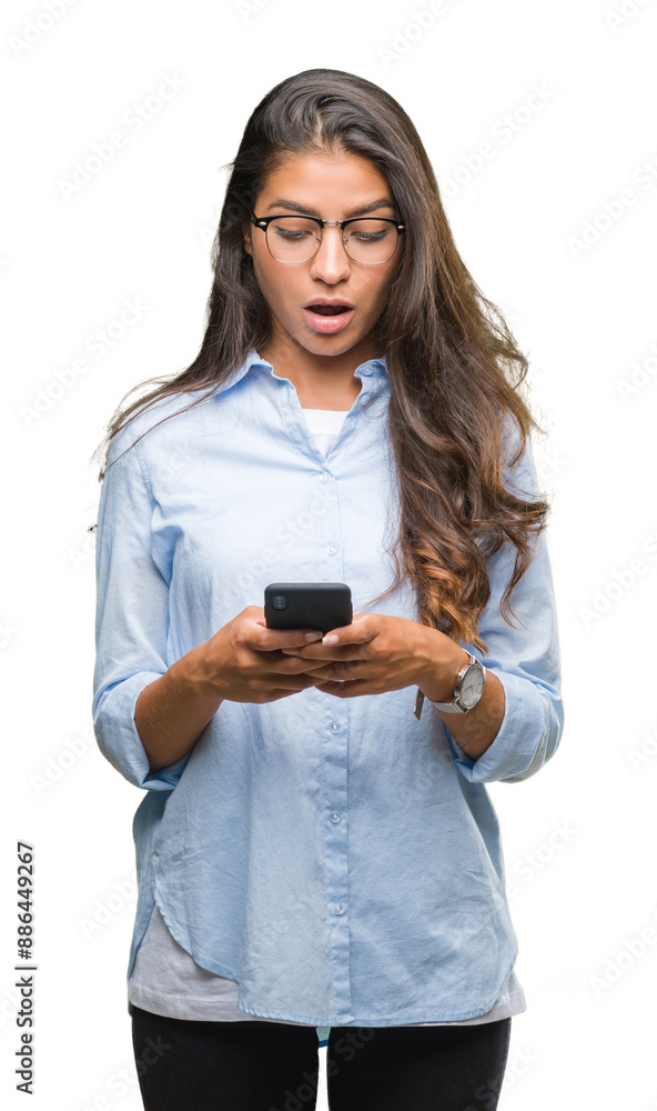 Poster Young beautiful arab woman texting using smartphone over isolated background scared in shock with a surprise face, afraid and excited with fear expression