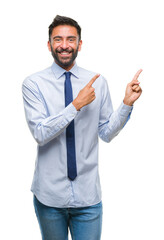 Adult hispanic business man over isolated background smiling and looking at the camera pointing with two hands and fingers to the side.