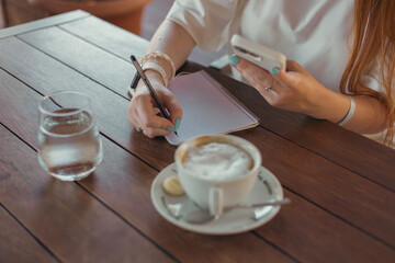 woman in cafe working or studying