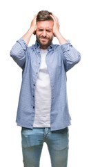 Young handsome man wearing white t-shirt over isolated background suffering from headache desperate...