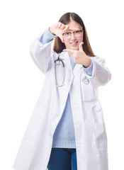 Young Chinese doctor woman over isolated background smiling making frame with hands and fingers with happy face. Creativity and photography concept.