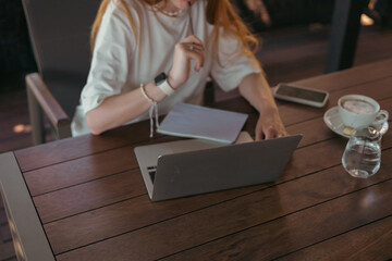 woman in cafe working or studying