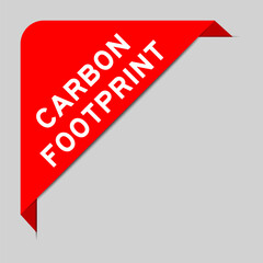 Red color of corner label banner with word carbon footprint on gray background