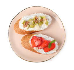 Delicious ricotta bruschettas with pear, strawberry and walnut isolated on white, top view