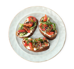 Delicious bruschettas with ricotta cheese, tomatoes and arugula isolated on white, top view