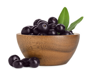 Fresh ripe acai berries in bowl and green leaves isolated on white