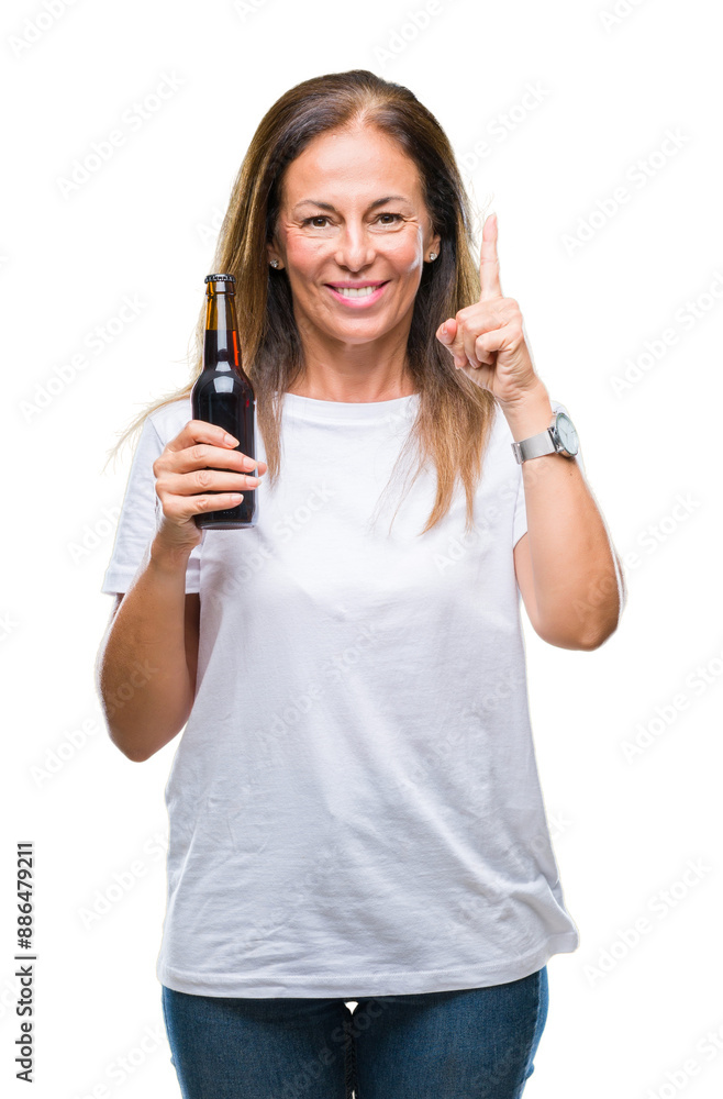 Wall mural middle age hispanic woman drinking beer over isolated background surprised with an idea or question 