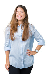 Obraz premium Young beautiful brunette business woman over isolated background winking looking at the camera with sexy expression, cheerful and happy face.