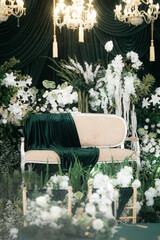 Elegant wedding decoration with a floral plant theme that is very lush like a forest. with a very romantic black background