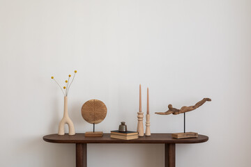 Stylish and minimalist composition on wooden design commode with copy space, flowers in vase,...