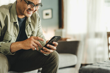 man using cell phone holding mobile texting message contact us.chatting,search internet shopping online.technology device communication connecting