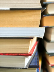Close-up of books. Stacks of books - close shooting. A lot of books in a stack.