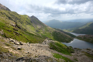 The Miners’ and Pyg Track converge at the base of Crib Goch ridge, adjacent to Glaslyn lake, in the Snowdonia Mountain Range, North Wales.