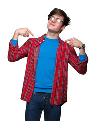 Young handsome student man wearing glasses over isolated background looking confident with smile on...