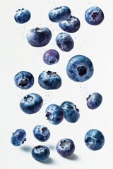 Healthy blueberries falling or floating against a white background isolated.
