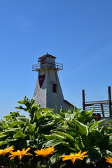 A small lighthouse under a blue sky, Prince Edward Island, Canada