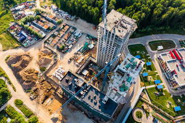 Drone view of the construction of a multi-storey building in a residential complex, construction...