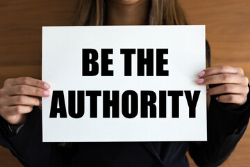 Be the authority. Woman with white page, black letters. Force, government, strength, domination.