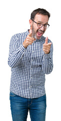 Naklejka premium Handsome middle age elegant senior business man wearing glasses over isolated background pointing fingers to camera with happy and funny face. Good energy and vibes.