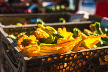 Zucchini flowers at a local tuscan farmers street market in Lucca Italy