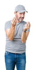 Handsome middle age hoary senior man wearing sport cap over isolated background Doing money gesture with hand, asking for salary payment, millionaire business