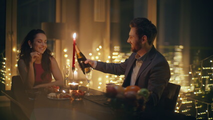 Enamoured pair celebrating anniversary big windows hotel romantic date closeup