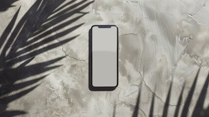 Smartphone with blank screen on gray surface, modern technology concept, minimalistic style, horizontal image, place for text