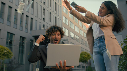 Two business people in city Indian happy rejoice yelling happy winner businessman worker man...
