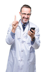 Middle age senior hoary doctor man texting using smartphone over isolated background surprised with an idea or question pointing finger with happy face, number one