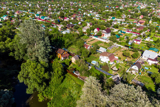 View from a low height of dense dacha development with garden plots