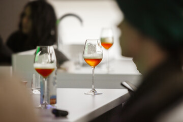 Preparation for Beer Tasting, Poured Alcoholic Drinks to Glasses on Table.