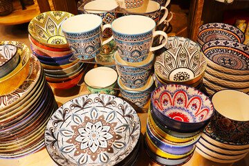 Festive ceramic tableware with Arabic pattern for festive table setting