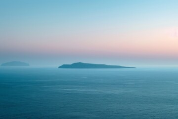 Obraz premium An idyllic view of a serene sea at dusk, with a silhouetted island in the distance, under a gradient sky from pink to blue.