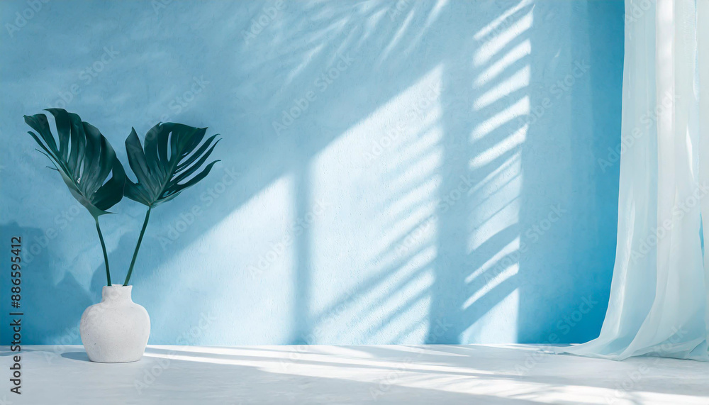 Poster blurred shadow from palm leaves on the light blue wall. minimal abstract background for product pres