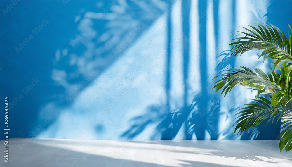 Poster blurred shadow from palm leaves on the light blue wall. minimal abstract background for product pres