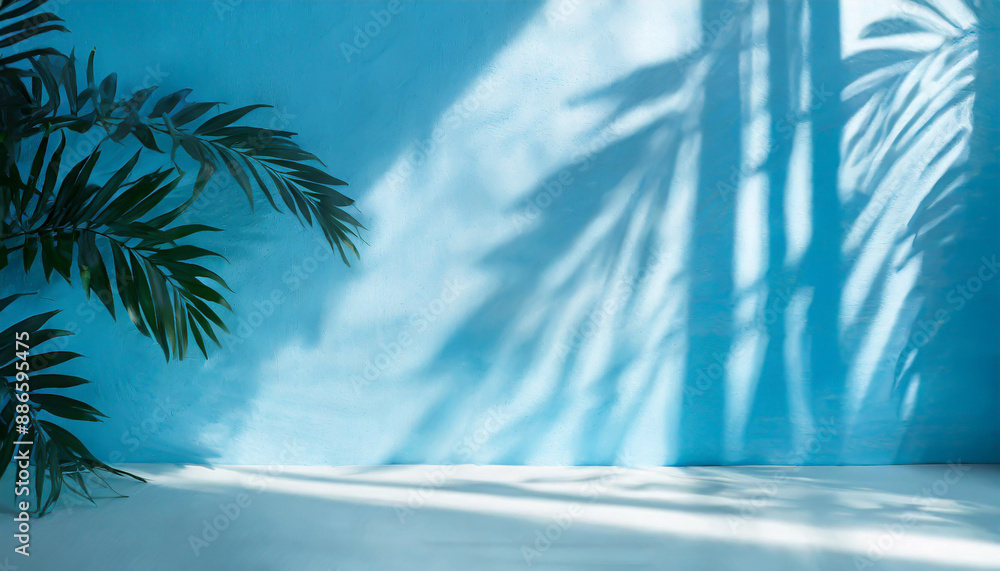 Poster blurred shadow from palm leaves on the light blue wall. minimal abstract background for product pres