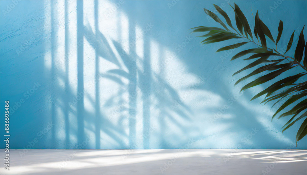 Poster blurred shadow from palm leaves on the light blue wall. minimal abstract background for product pres